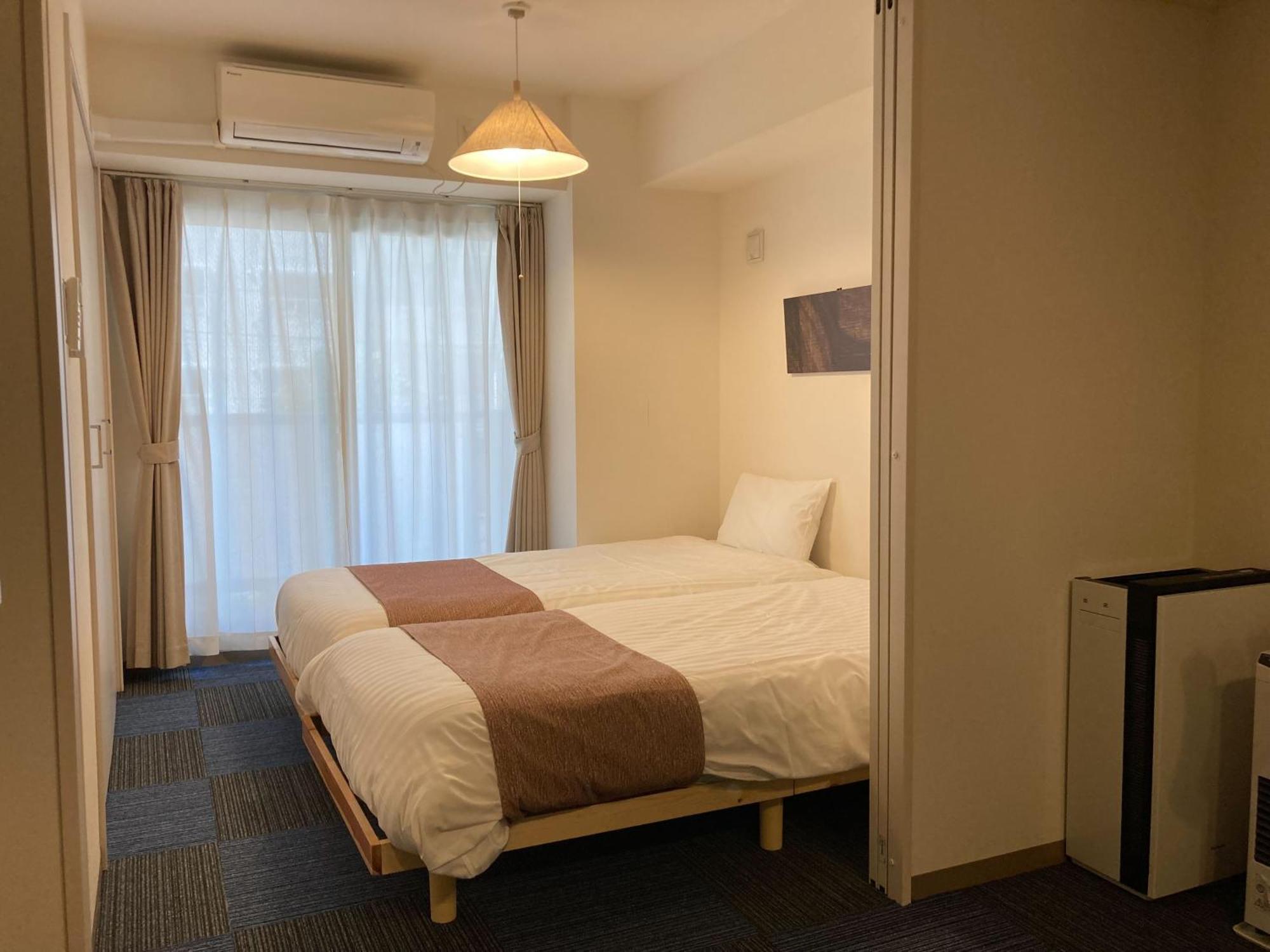 Ferienwohnung Tsubaki Garden Sapporo Zimmer foto