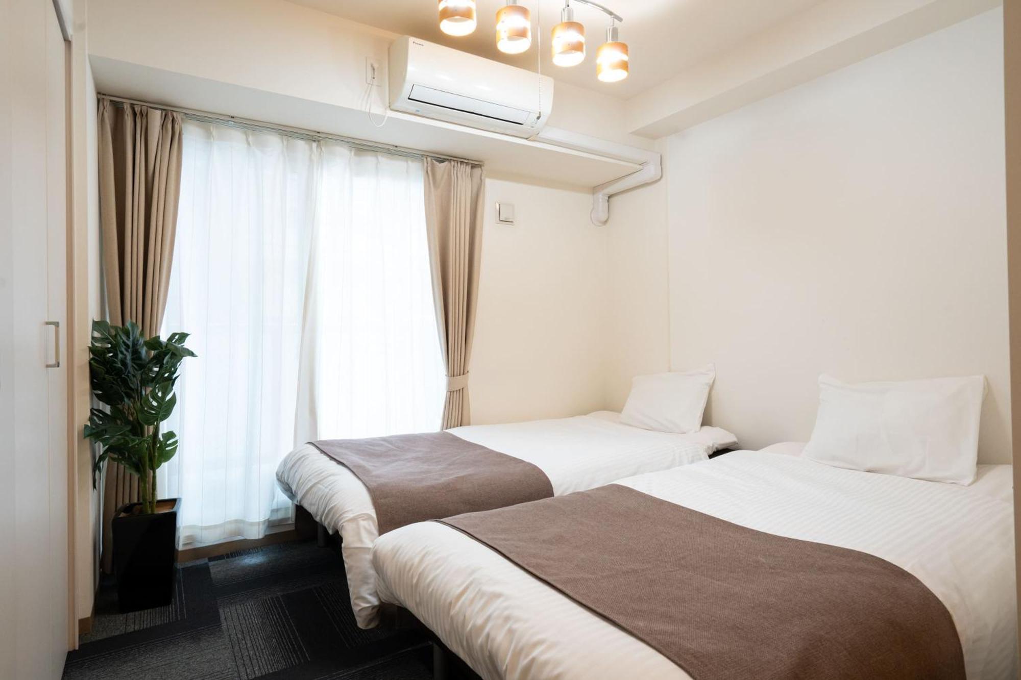 Ferienwohnung Tsubaki Garden Sapporo Zimmer foto